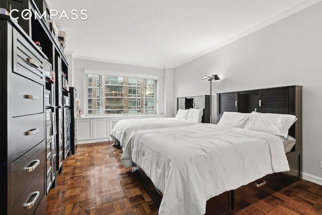 bedroom with crown molding