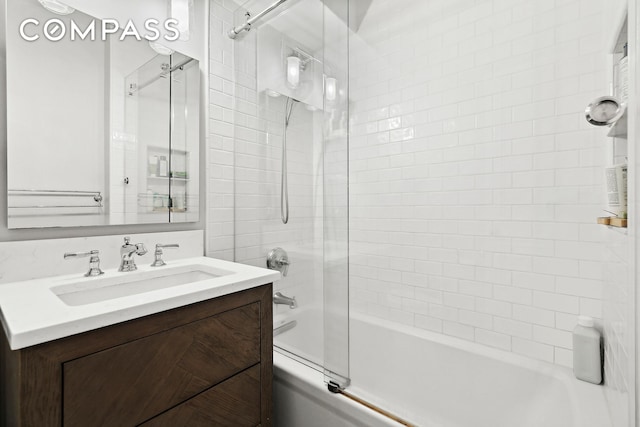 bathroom with washtub / shower combination and vanity