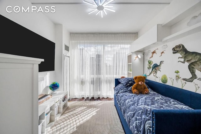 bedroom featuring a notable chandelier and visible vents
