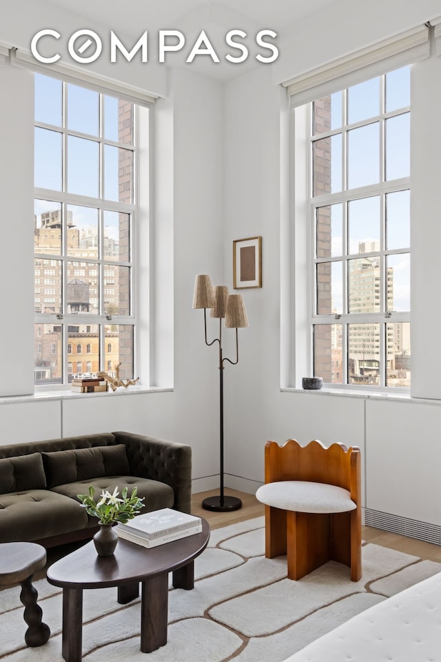 145 Hudson St Unit 7B, New York City, NY 10013 - living room featuring a city view, healthy amount of natural light, and wood finished floors