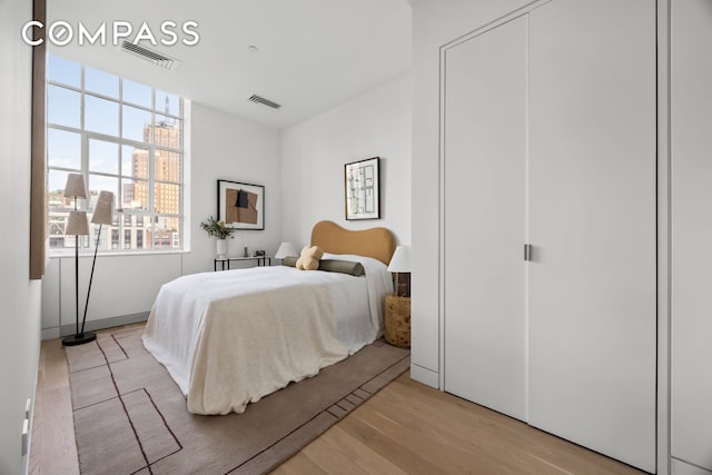 145 Hudson St Unit 7B, New York City, NY 10013 - bedroom with light wood-style flooring and a view of city