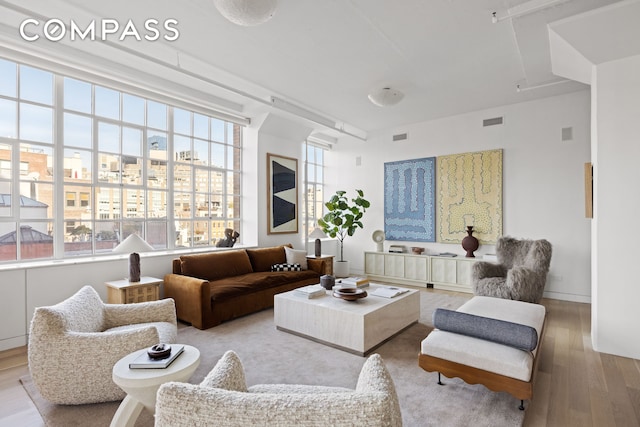 145 Hudson St Unit 7B, New York City, NY 10013 - living room featuring wood finished floors