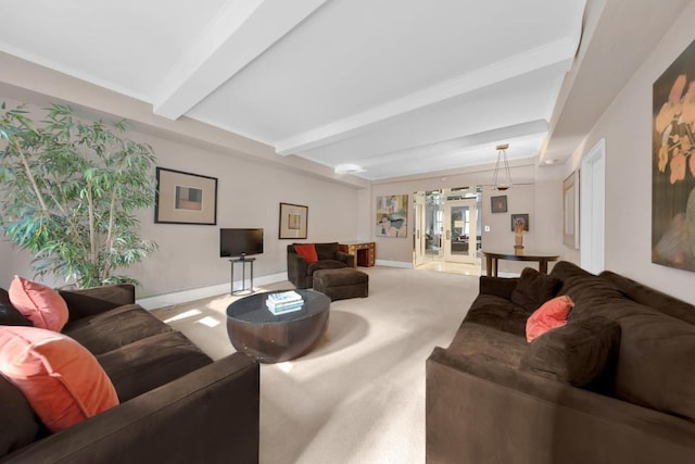 living room featuring beamed ceiling and carpet flooring