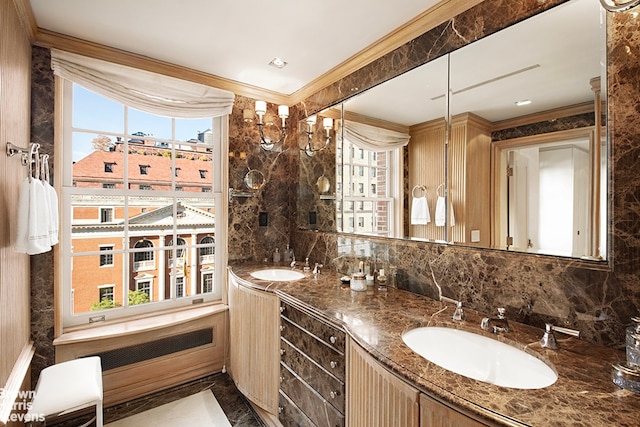 bathroom with decorative backsplash, ornamental molding, vanity, and tile walls