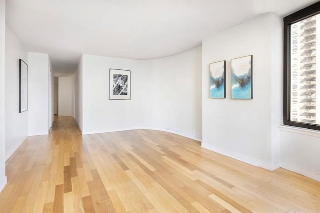 spare room featuring light hardwood / wood-style flooring