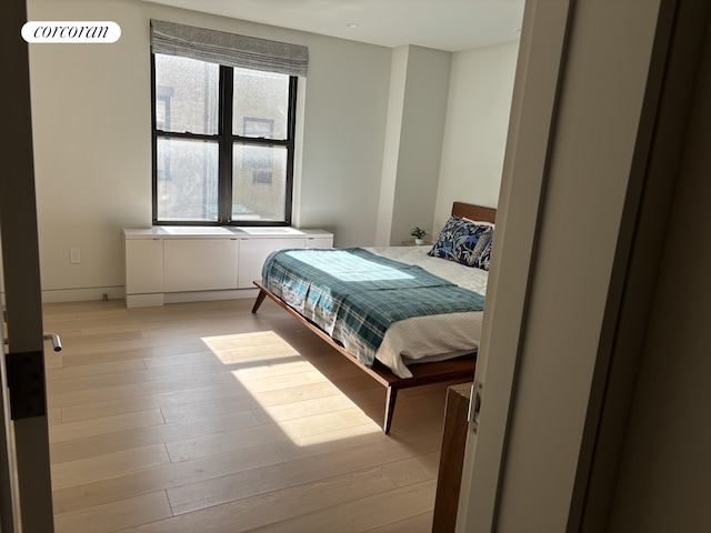 bedroom with light wood-style flooring