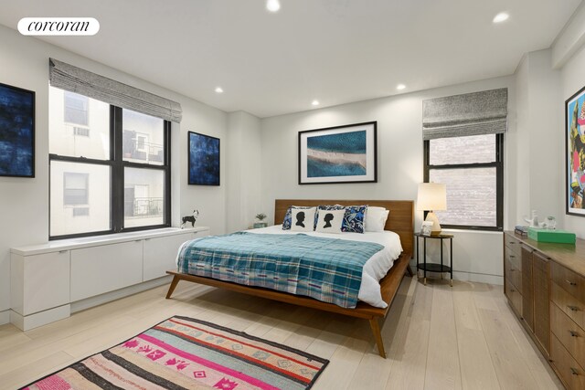 12 W 72nd St Unit 3Kl, New York City, NY 10023 - bedroom with multiple windows, light wood-style flooring, and recessed lighting