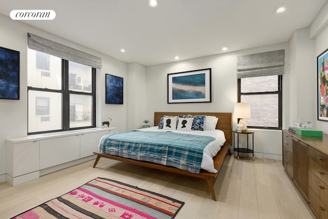 bedroom featuring recessed lighting, visible vents, light wood-style flooring, and baseboards