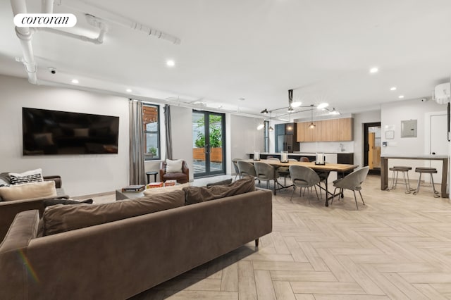 living room with electric panel, french doors, and light parquet floors