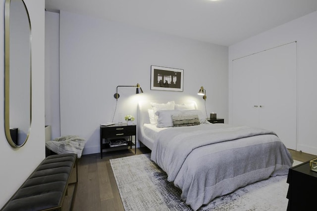 bedroom with dark wood-type flooring