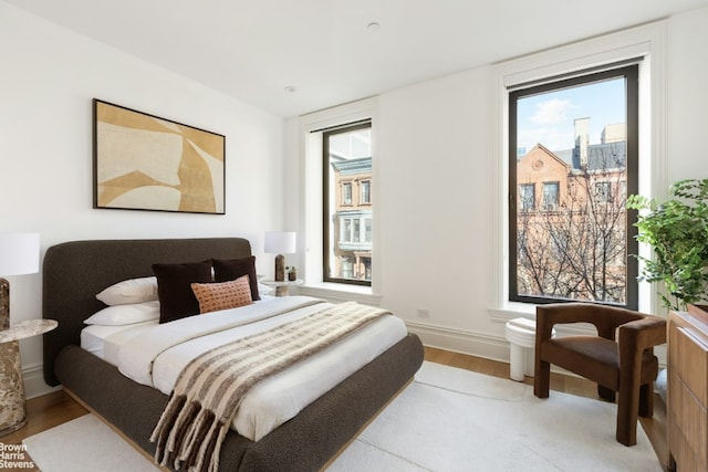 bedroom with light wood-type flooring