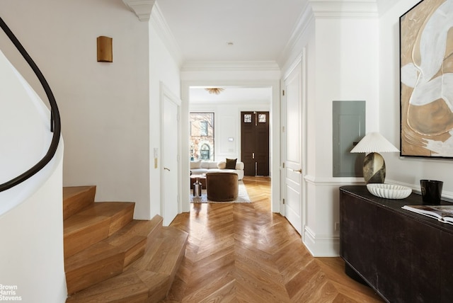 corridor with light parquet flooring and ornamental molding