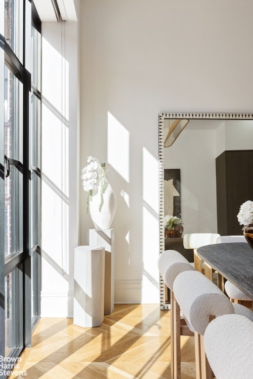 interior space featuring a high ceiling and light parquet flooring