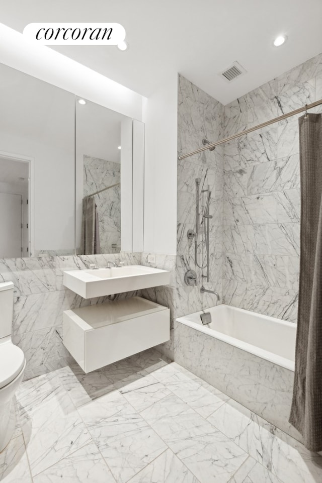 bathroom with toilet, marble finish floor, recessed lighting, visible vents, and a combined bath / shower with marble appearance