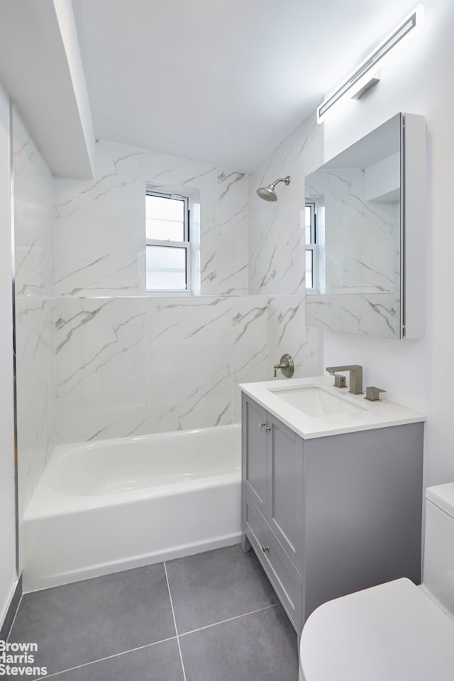 full bath with toilet, tile patterned flooring, bathing tub / shower combination, and vanity