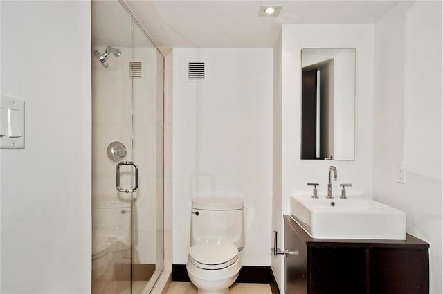 bathroom featuring toilet, a stall shower, visible vents, and vanity