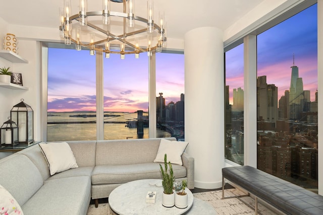 250 S St S Unit 27M, New York City, NY 10002 - living area featuring a chandelier, a water view, a view of skyline, and baseboards