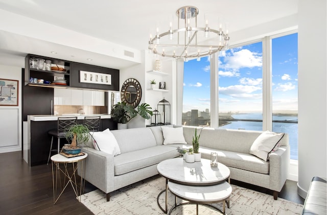 250 S St S Unit 27M, New York City, NY 10002 - living room with a chandelier, wood finished floors, a water view, and plenty of natural light