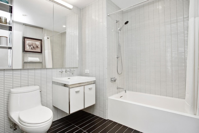250 S St S Unit 27M, New York City, NY 10002 - full bath with tile walls, shower / bathtub combination, vanity, and toilet