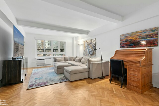 living area with an inviting chandelier and beam ceiling