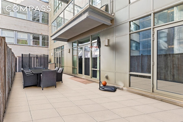 view of patio / terrace with outdoor dining area and fence