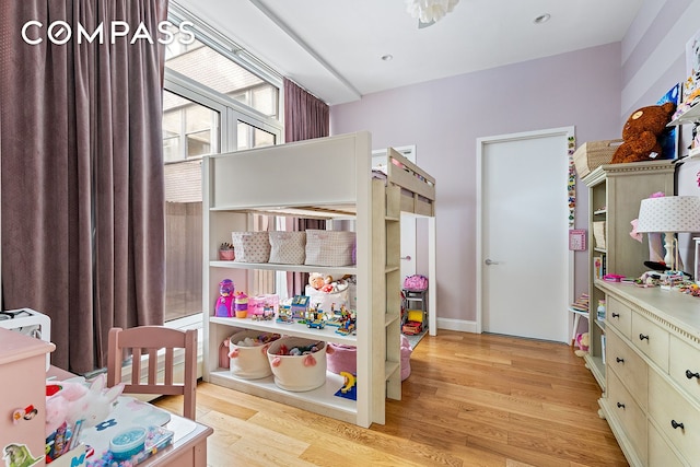 bedroom featuring light wood-style flooring