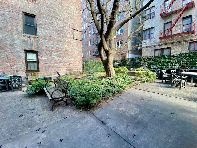37 Nagle Ave Unit 1-C, New York City, NY 10040 - view of home's community with outdoor dining space and a patio area