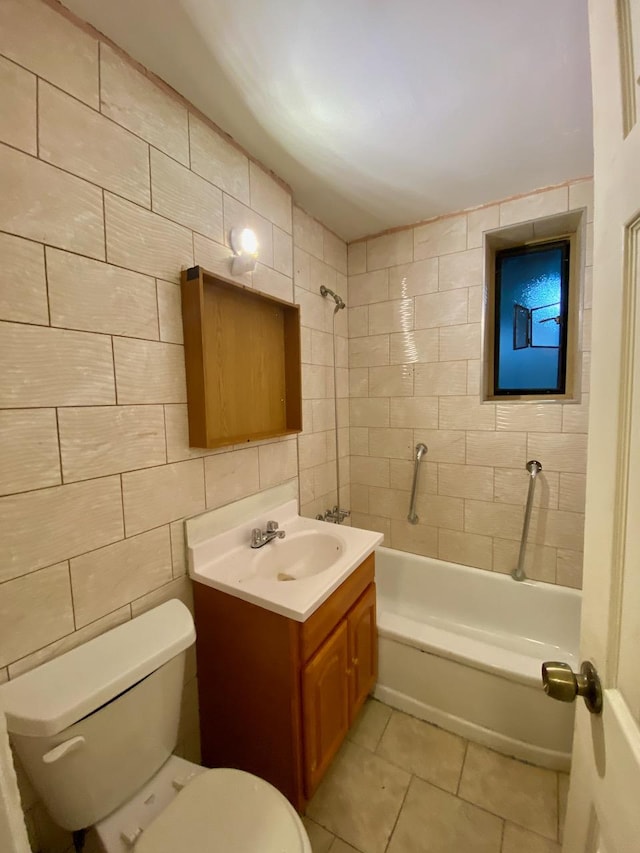 37 Nagle Ave Unit 1-C, New York City, NY 10040 - full bathroom featuring vanity, tile patterned floors, shower / bath combination, and tile walls
