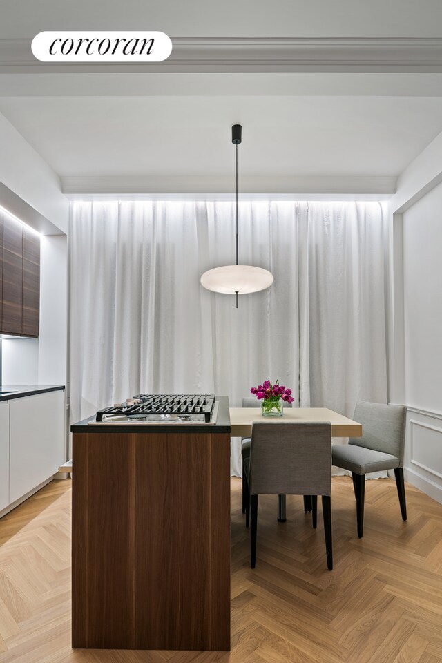 kitchen with stainless steel gas cooktop and modern cabinets