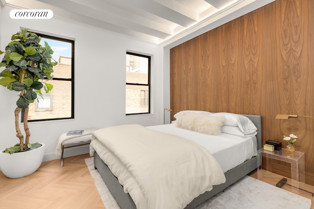 bedroom with visible vents and beamed ceiling