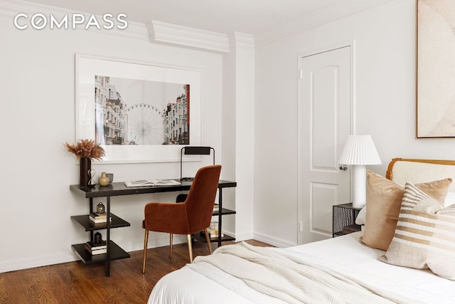 bedroom featuring crown molding and dark wood-type flooring