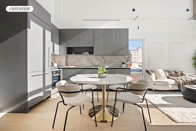 dining area with light wood-style floors