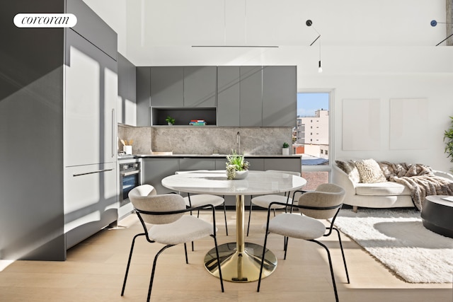 dining area featuring light wood finished floors