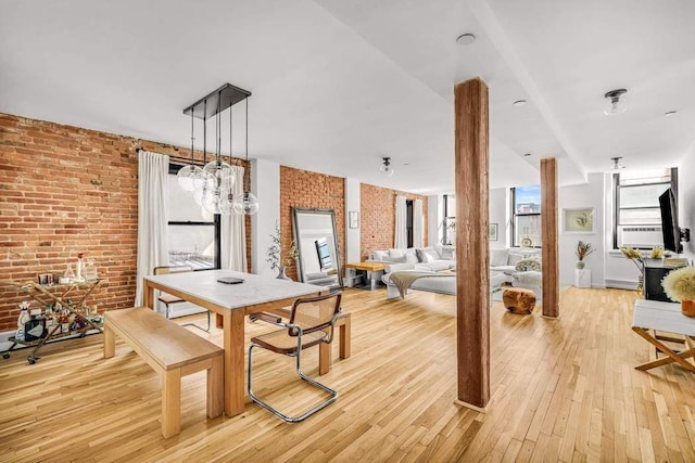 264 Water St Unit 5B, New York City, NY 10038 - dining space featuring brick wall and light wood finished floors