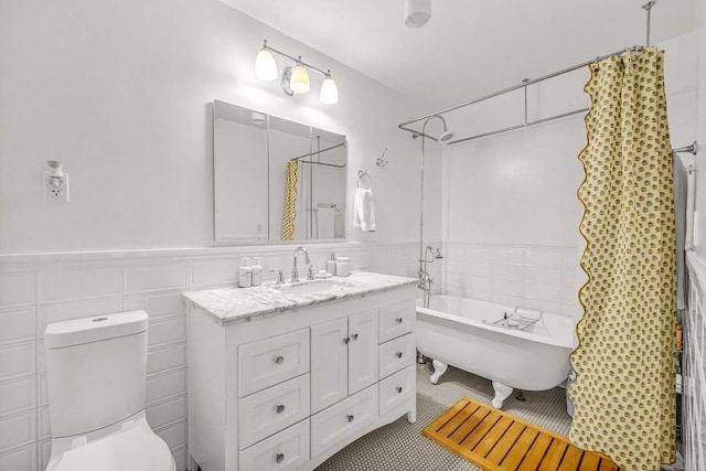 264 Water St Unit 5B, New York City, NY 10038 - bathroom with a freestanding bath, tile patterned flooring, vanity, and tile walls