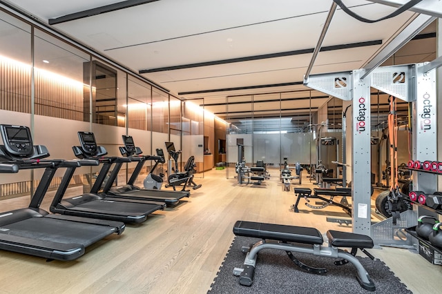 exercise room with wood finished floors