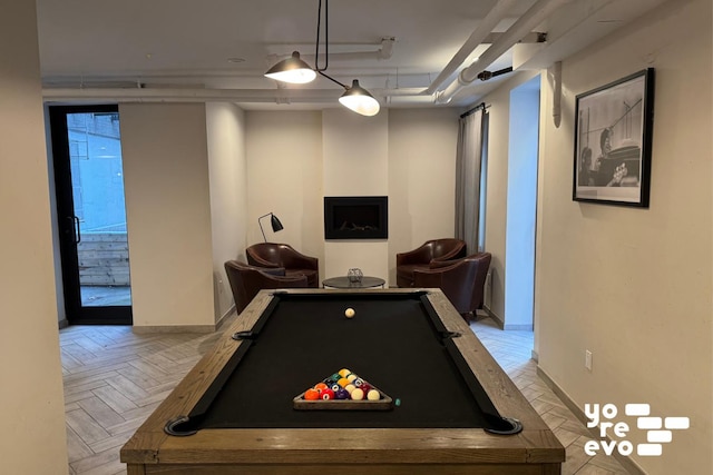 game room featuring pool table and baseboards