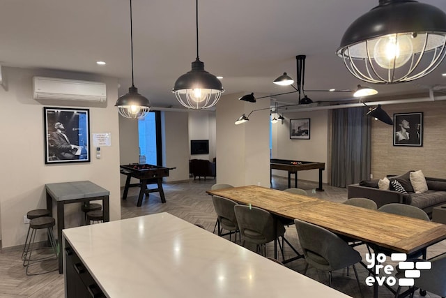 dining room with recessed lighting, a wall mounted air conditioner, and baseboards