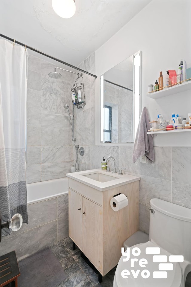 bathroom featuring tiled shower / bath combo, decorative backsplash, vanity, and tile walls