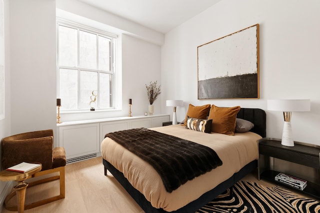 bedroom featuring light wood finished floors