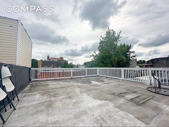 view of patio / terrace featuring fence