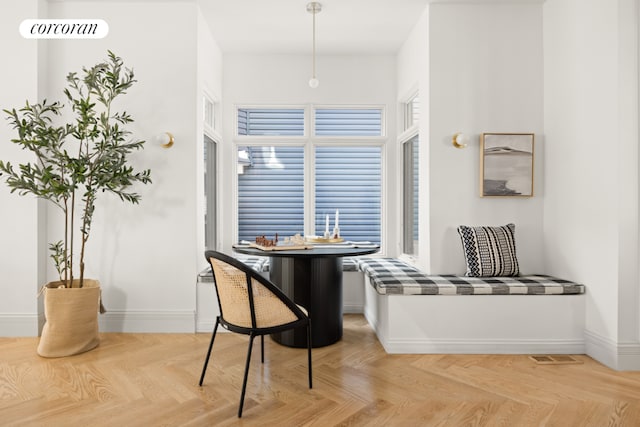 dining area with light parquet floors