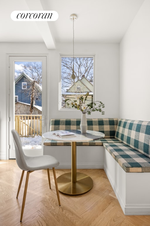 dining room with breakfast area and light hardwood / wood-style floors