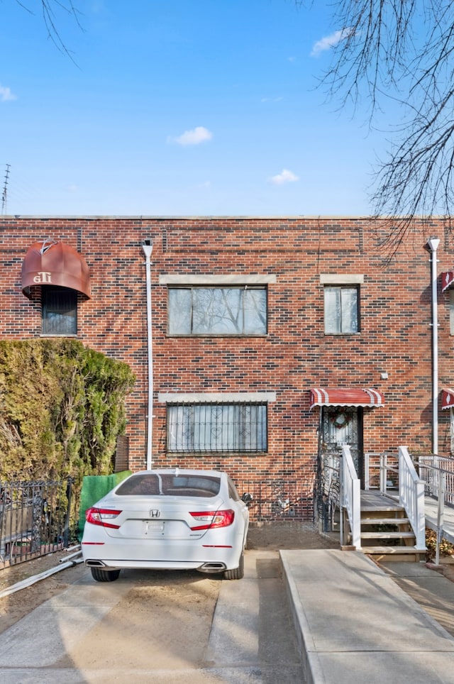 view of front of property featuring brick siding