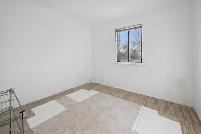 empty room featuring wood finished floors