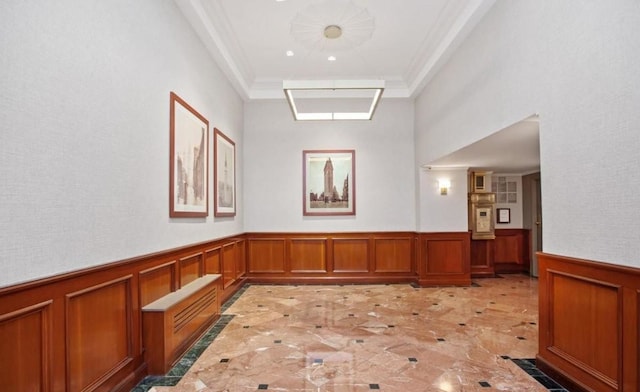 66 Madison Ave Unit 1A, New York City, NY 10016 - hallway with light marble finish flooring, wainscoting, ornamental molding, and a decorative wall