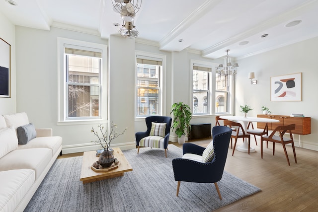 66 Madison Ave Unit 1A, New York City, NY 10016 - living room featuring a chandelier, wood finished floors, healthy amount of natural light, ornamental molding, and baseboards