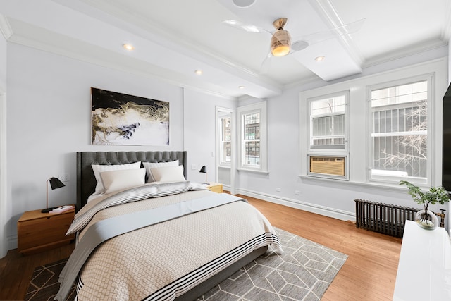 66 Madison Ave Unit 1A, New York City, NY 10016 - bedroom with radiator heating unit, crown molding, light wood-style floors, recessed lighting, and baseboards