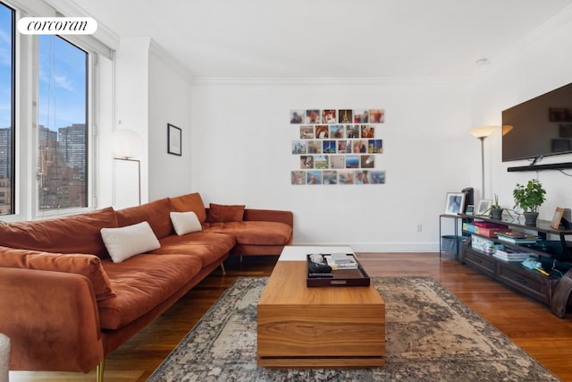 living room with dark hardwood / wood-style flooring and crown molding