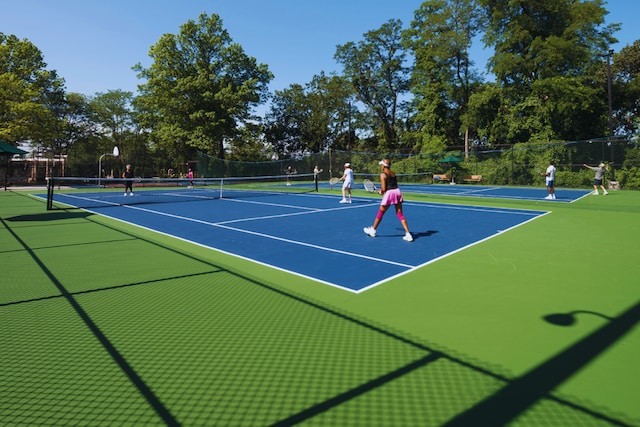 view of tennis court featuring fence